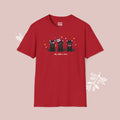 Red t-shirt with black cat illustration and text on a pink background