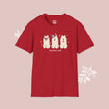 Red t-shirt with a graphic of three dogs and text on a pink background