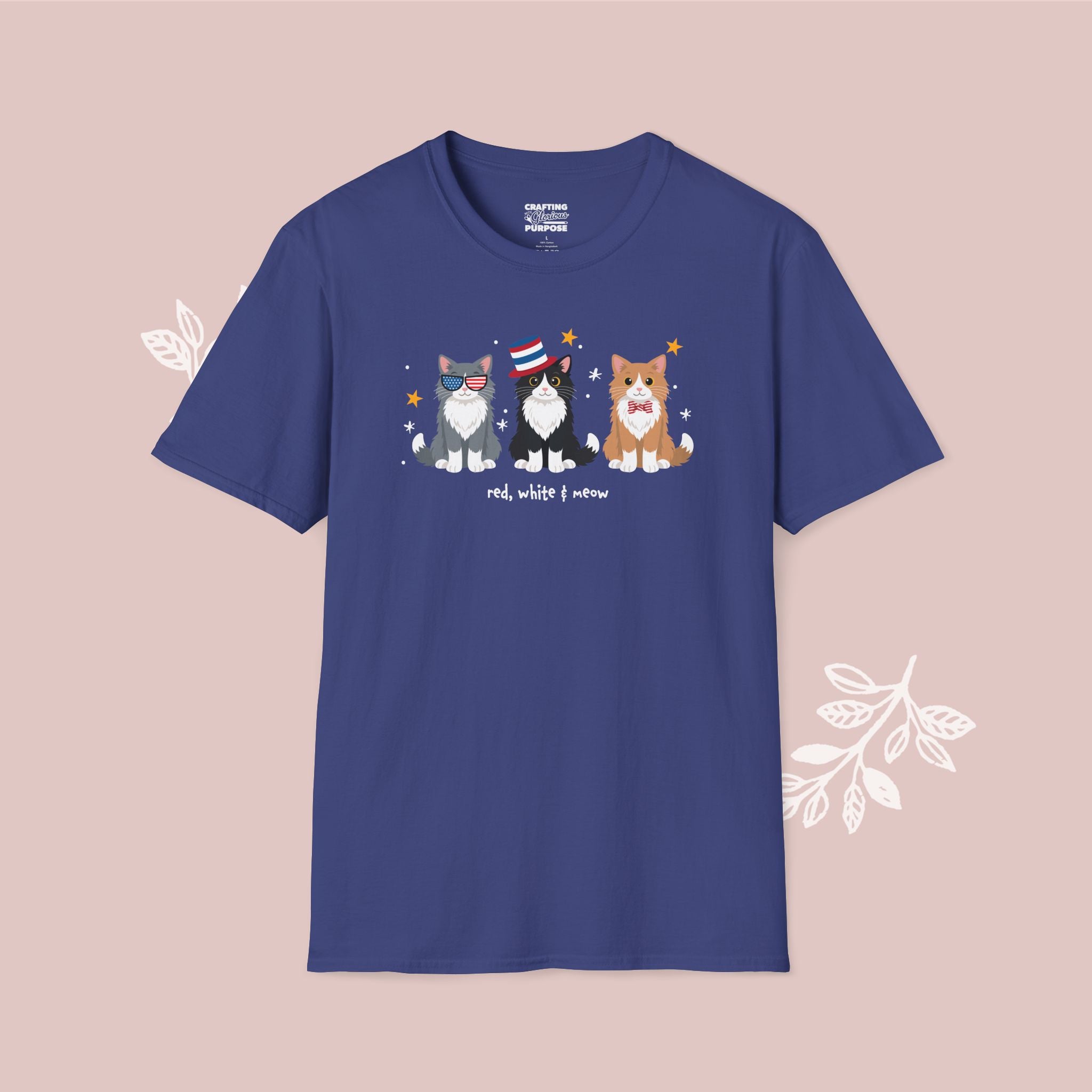 Blue t-shirt with cartoon cats design on a pink background