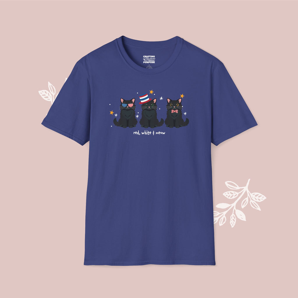 Blue t-shirt with black cat illustrations and text on a pink background