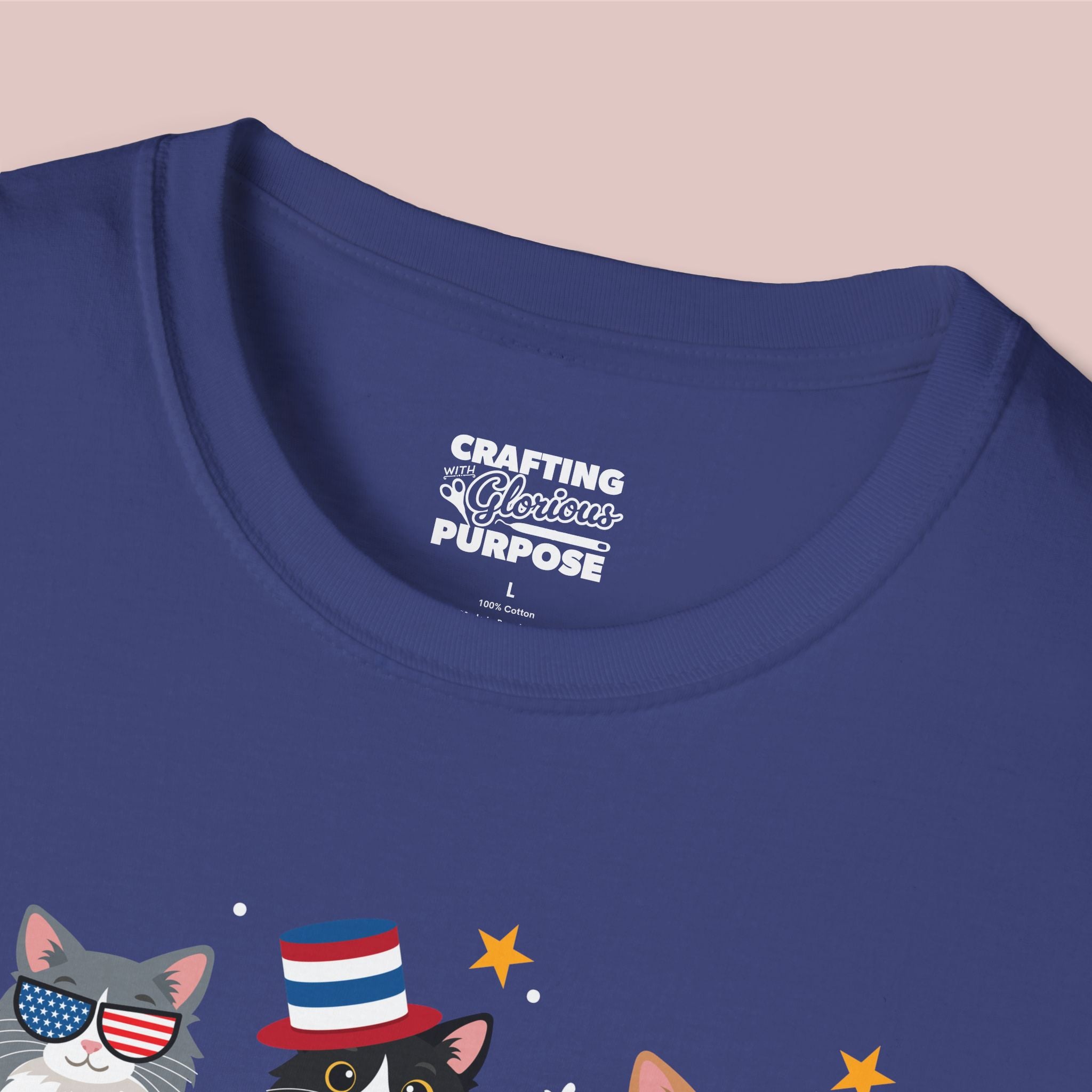 Navy blue t-shirt with cat graphics and 'Crafting a Glorious Purpose' text on a beige background