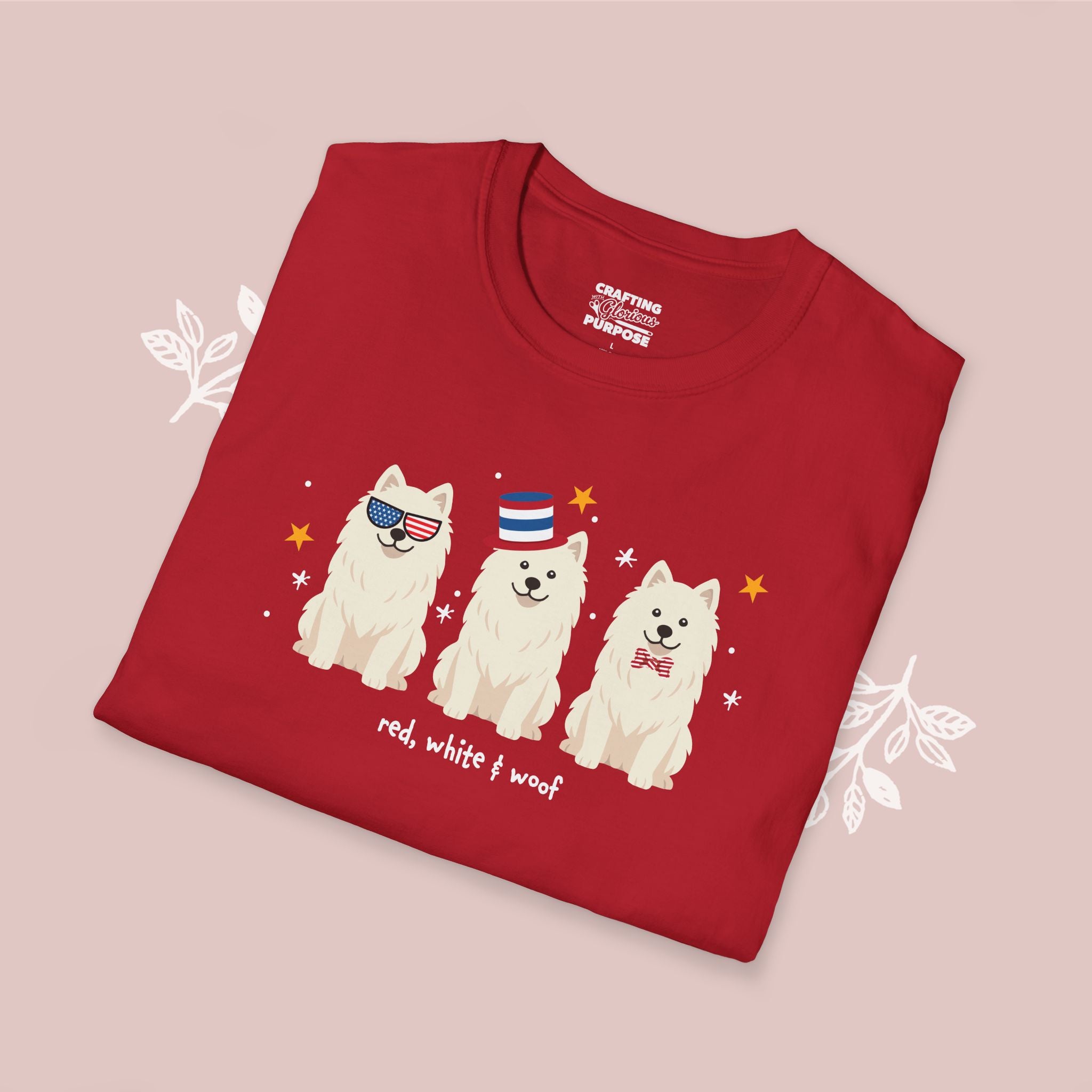 Folded red t-shirt with bulldog illustrations and text on a pink background