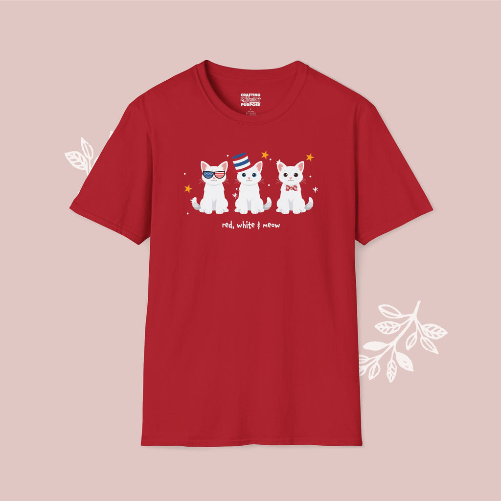Red t-shirt with cartoon cats design on a pink background