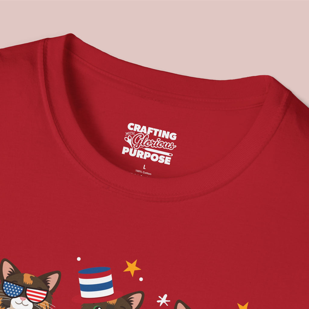 Red t-shirt with graphic design and text on a pink background