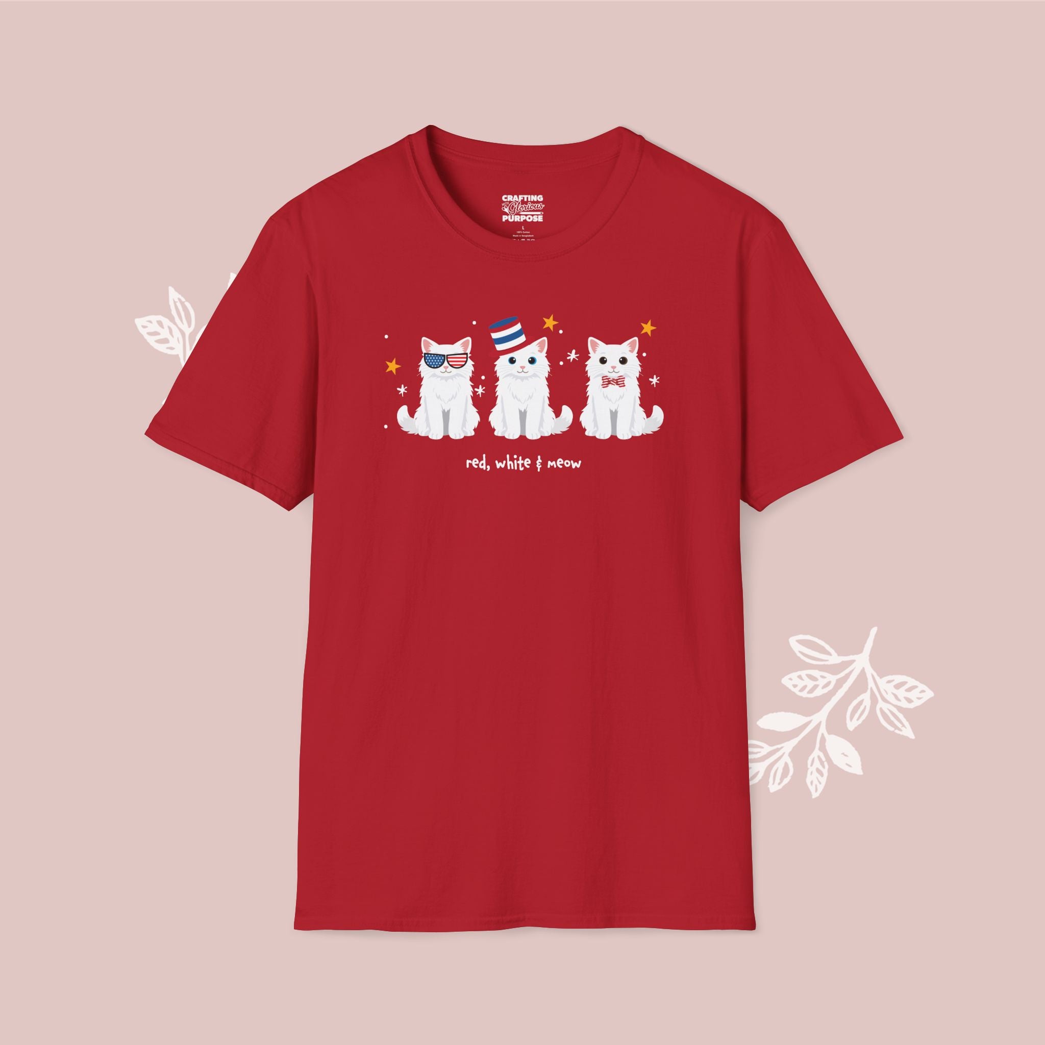 Red t-shirt with white cat illustration on a pink background
