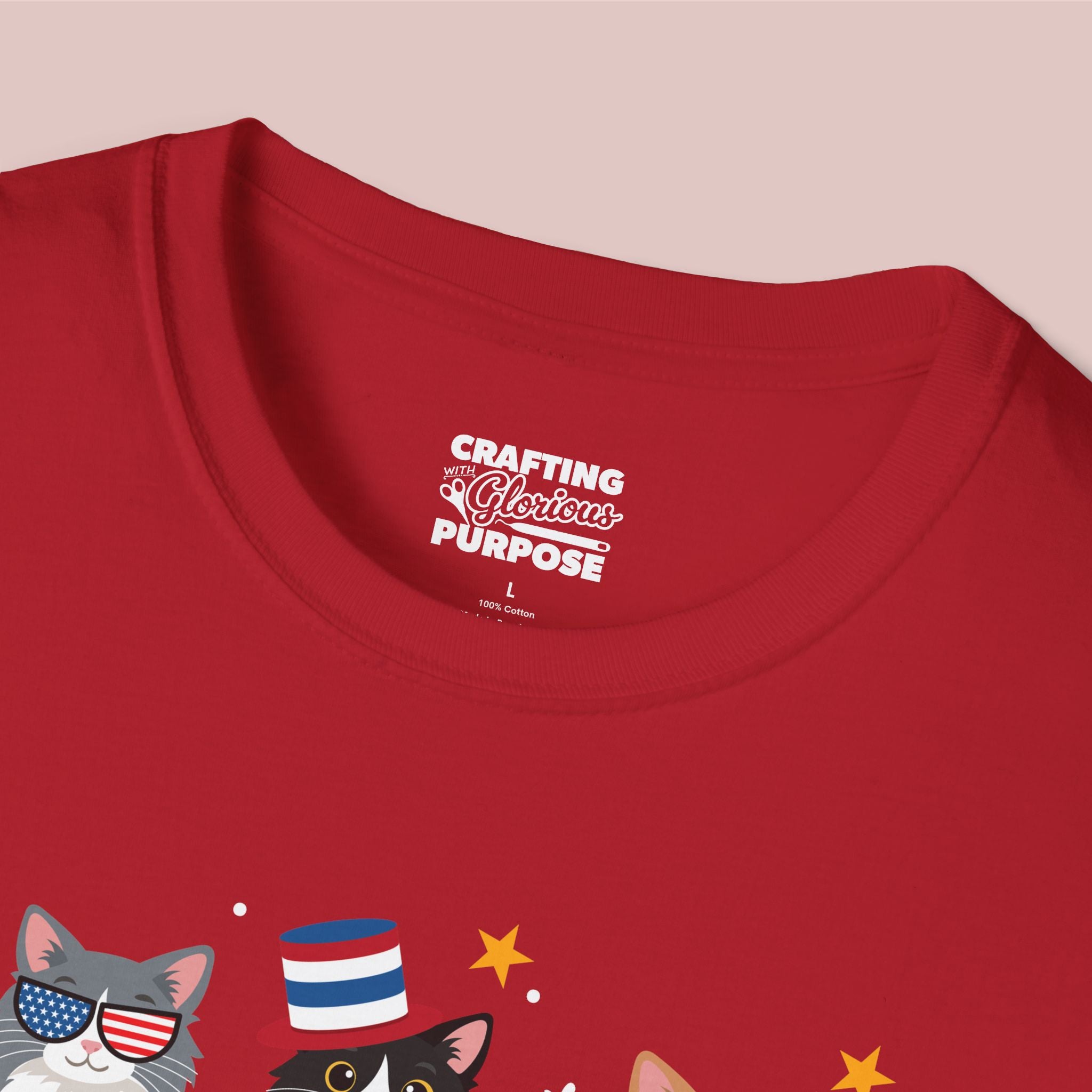 Red t-shirt with cat graphics and 'Crafting a Glorious Purpose' text on a pink background
