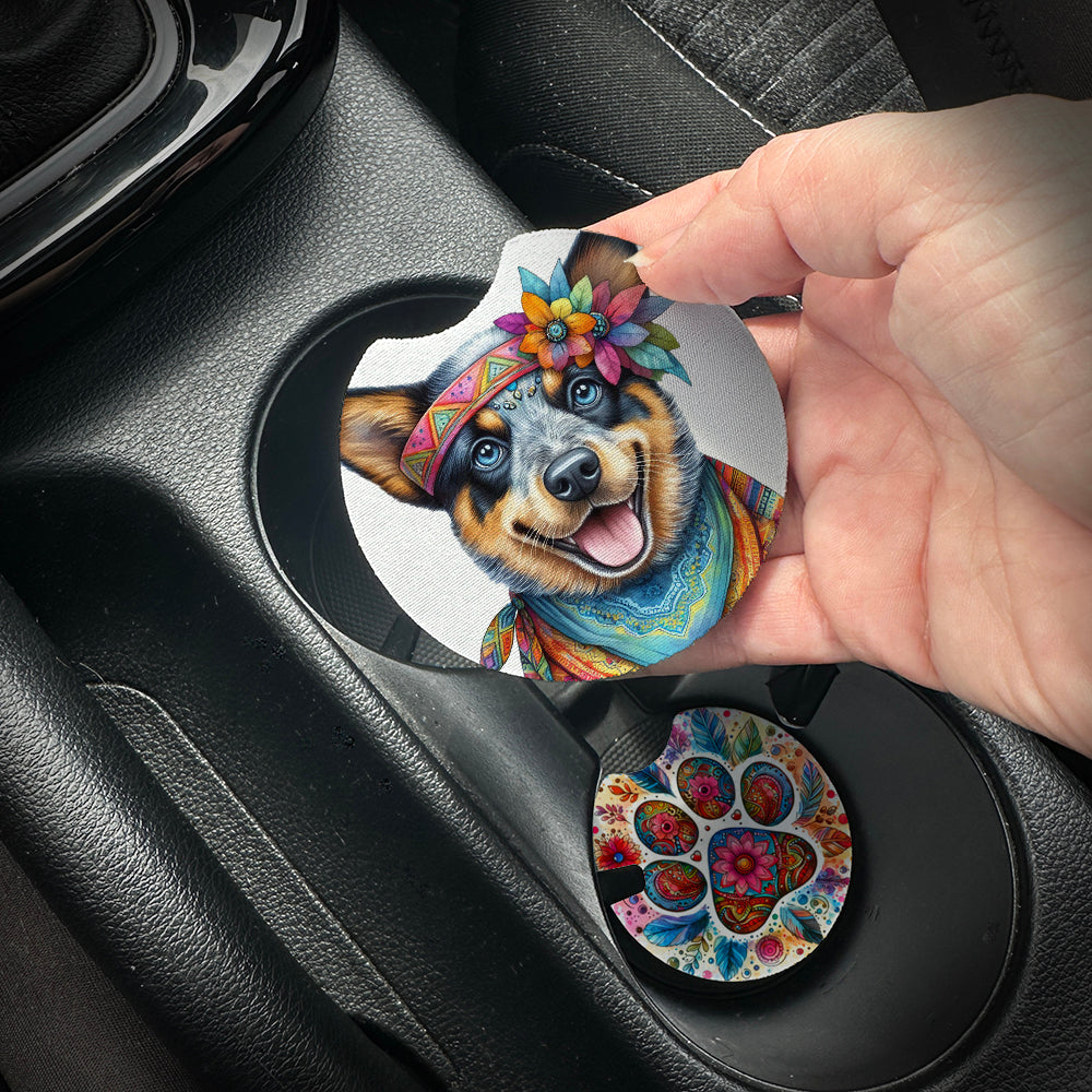 Hand placing a colorful car coaster with a dog design into a car cup holder.