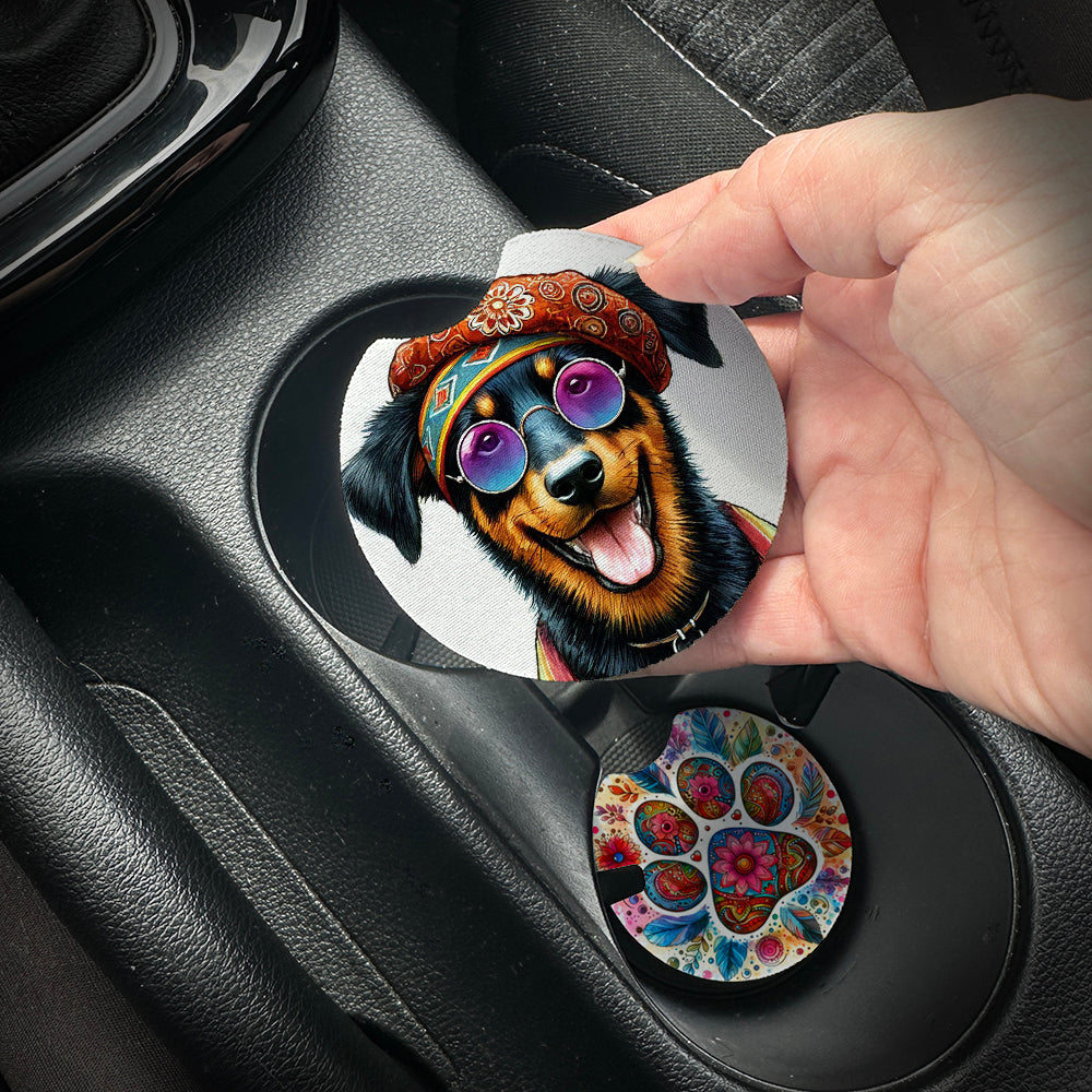Hand placing a colorful car coaster with a dog design into a car cup holder.