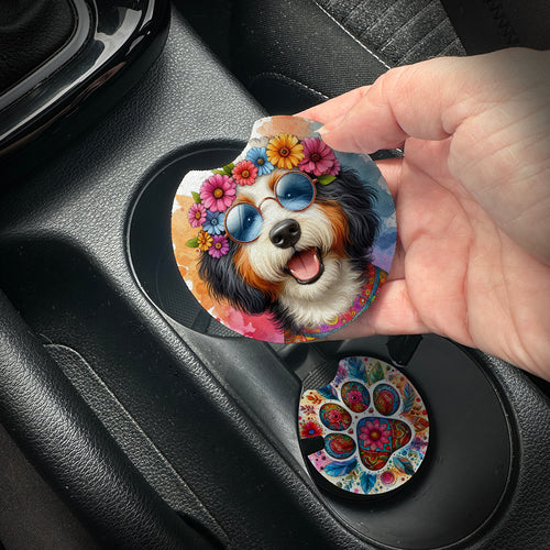 Hand placing a colorful car coaster with a dog design into a car cup holder.