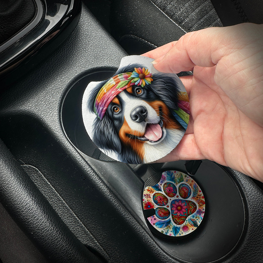 Hand placing a colorful car coaster with a dog design into a car cup holder.