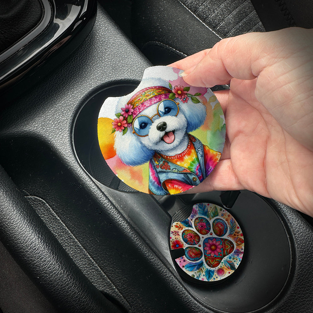Hand placing a colorful car coaster with a dog design into a car cup holder.