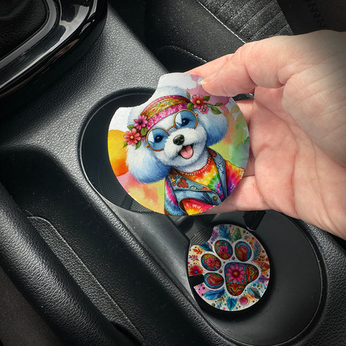 Hand placing a colorful car coaster with a dog design into a car cup holder.