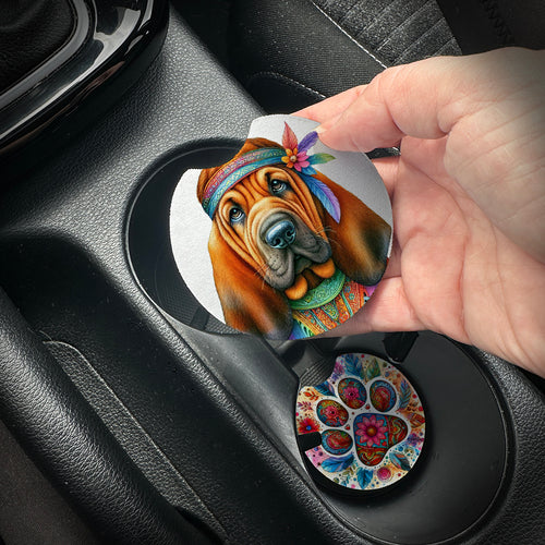 Hand placing a colorful car coaster with a dog design into a car cup holder.