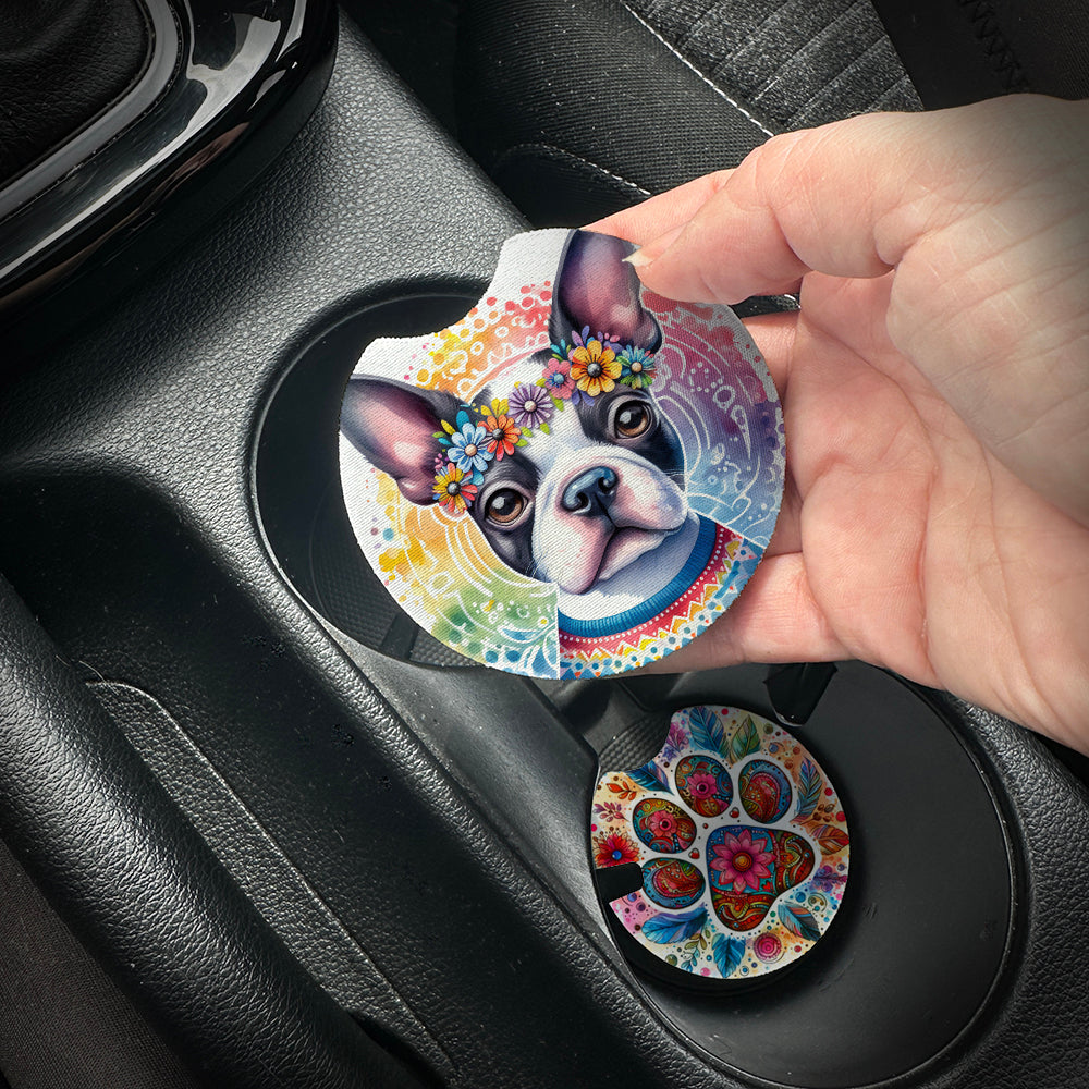 Hand placing a colorful car coaster with a dog design into a car cup holder.