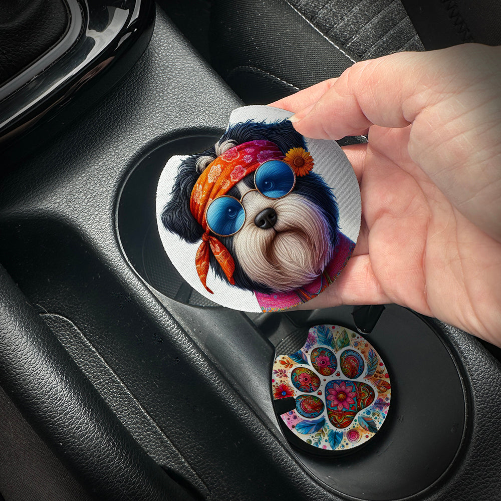 Hand placing a colorful car coaster with a dog design into a car cup holder.