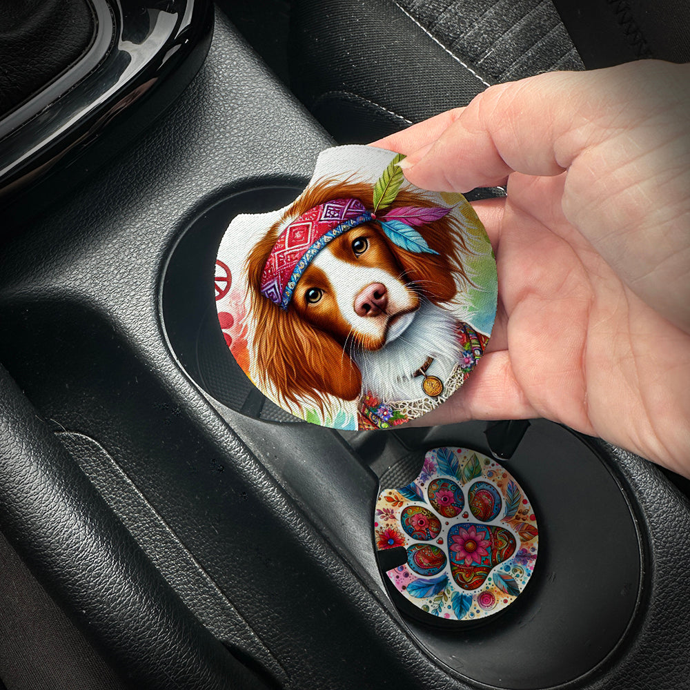 Hand placing a colorful car coaster with a dog design into a car cup holder.