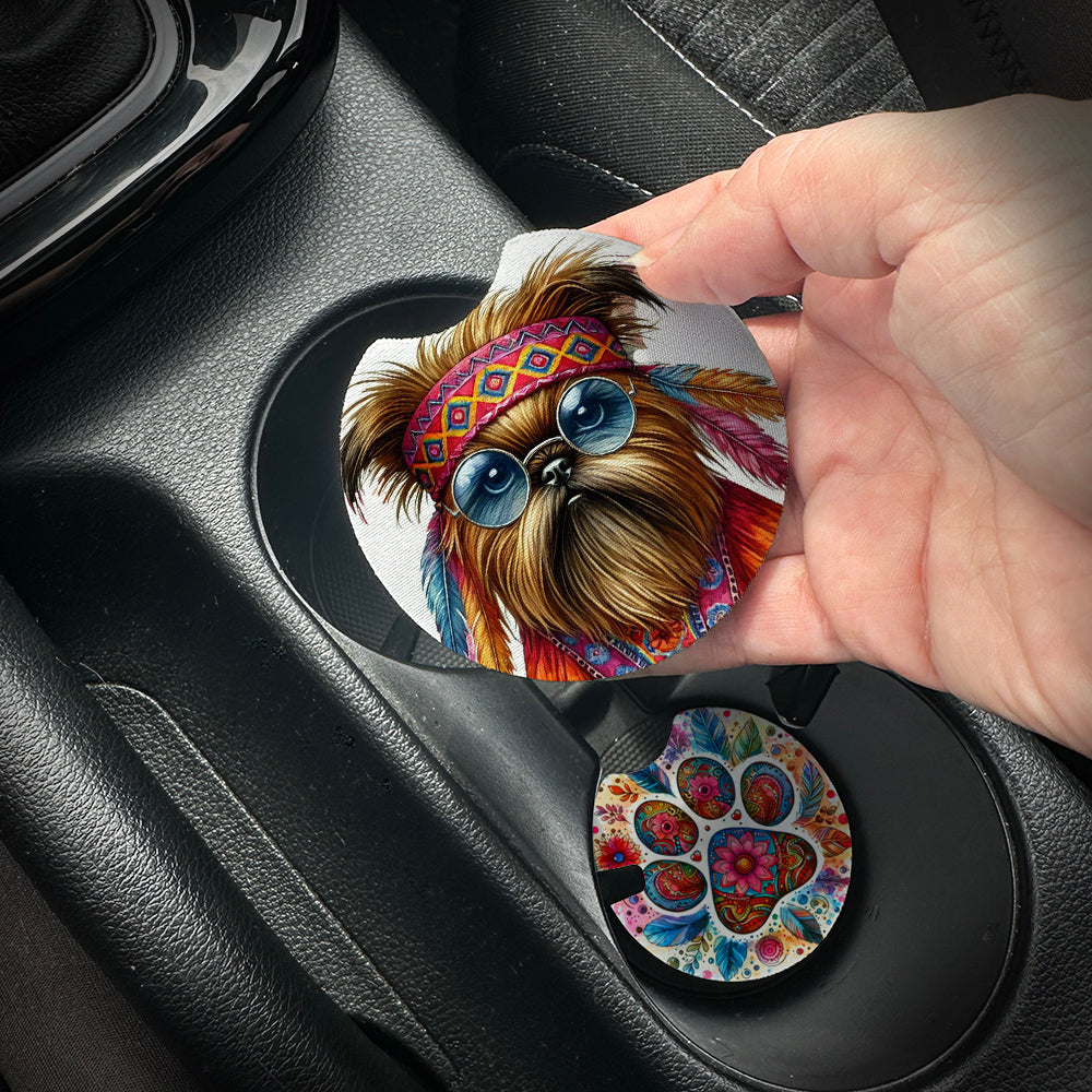 Hand placing a colorful car coaster with a dog design into a car cup holder.
