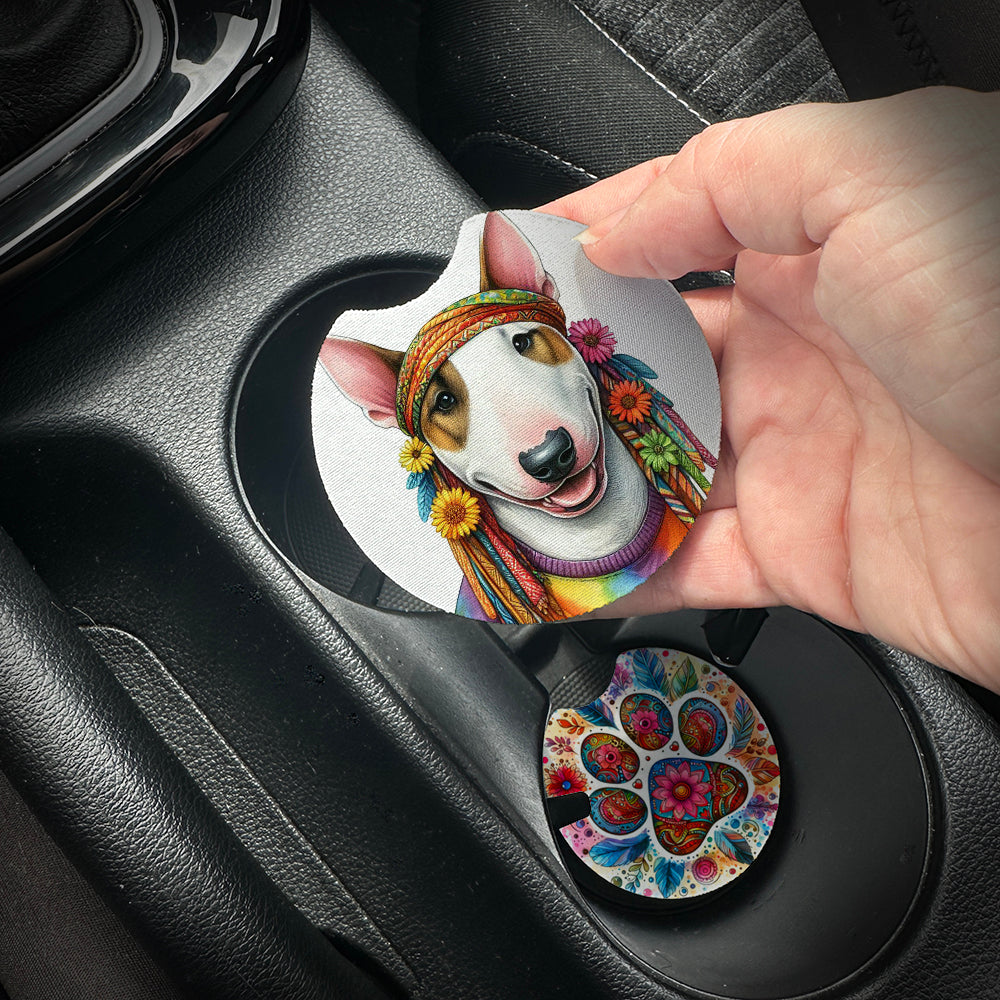 Hand placing a colorful car coaster with a dog design into a car cup holder.