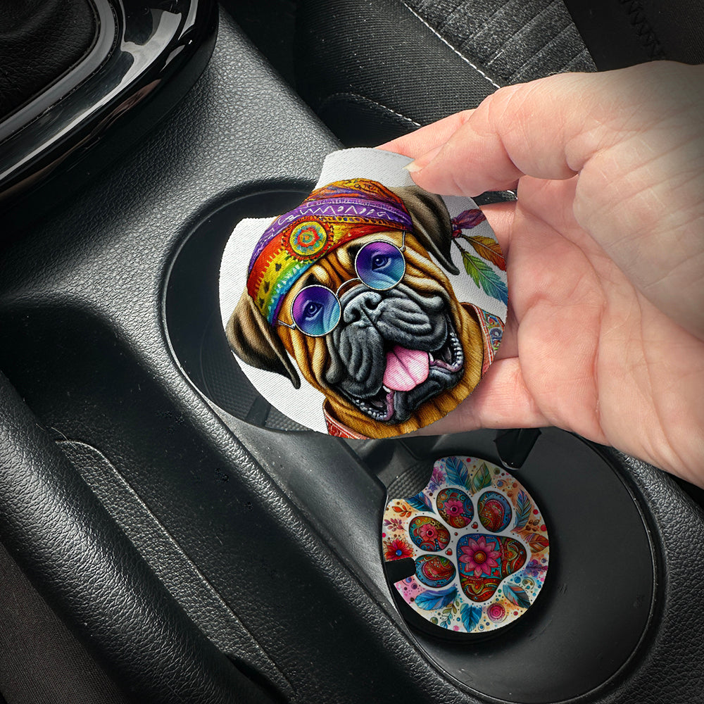 Hand placing a colorful car coaster with a dog design into a car cup holder.