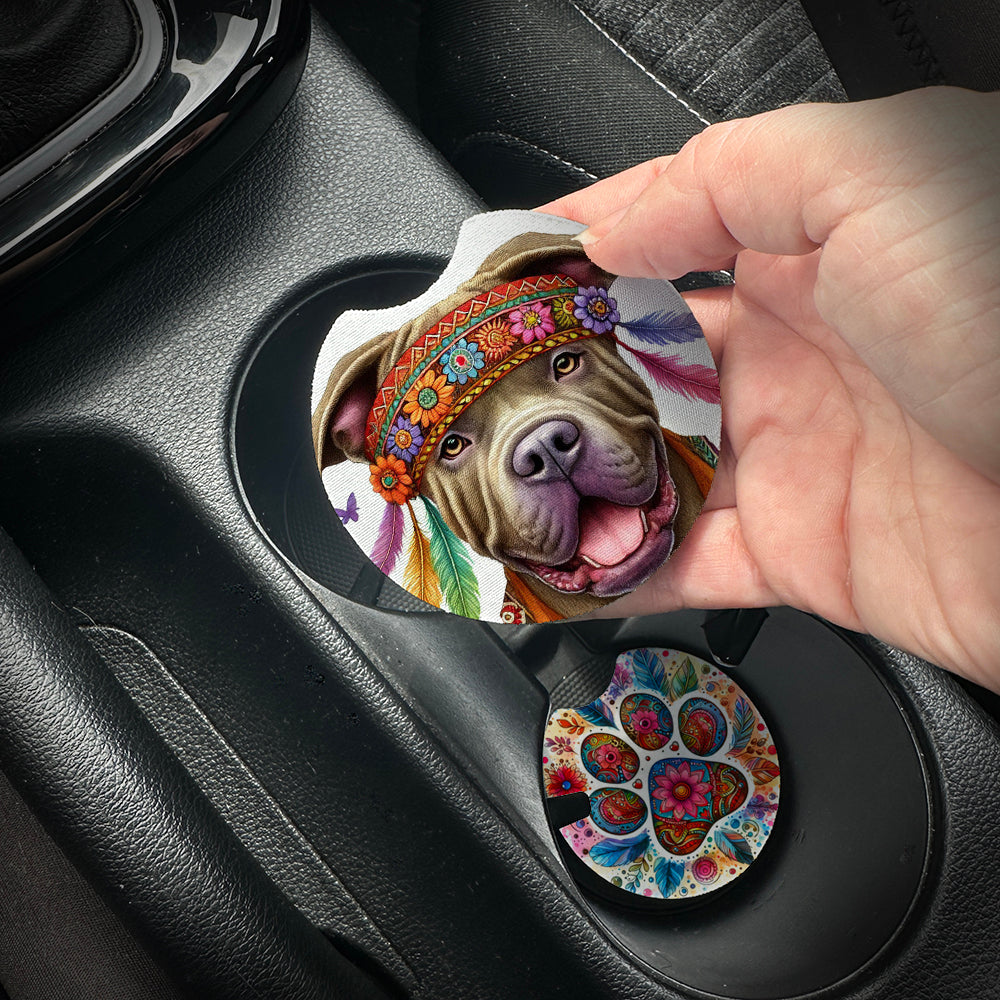 Hand placing a colorful car coaster with a dog design into a car cup holder.