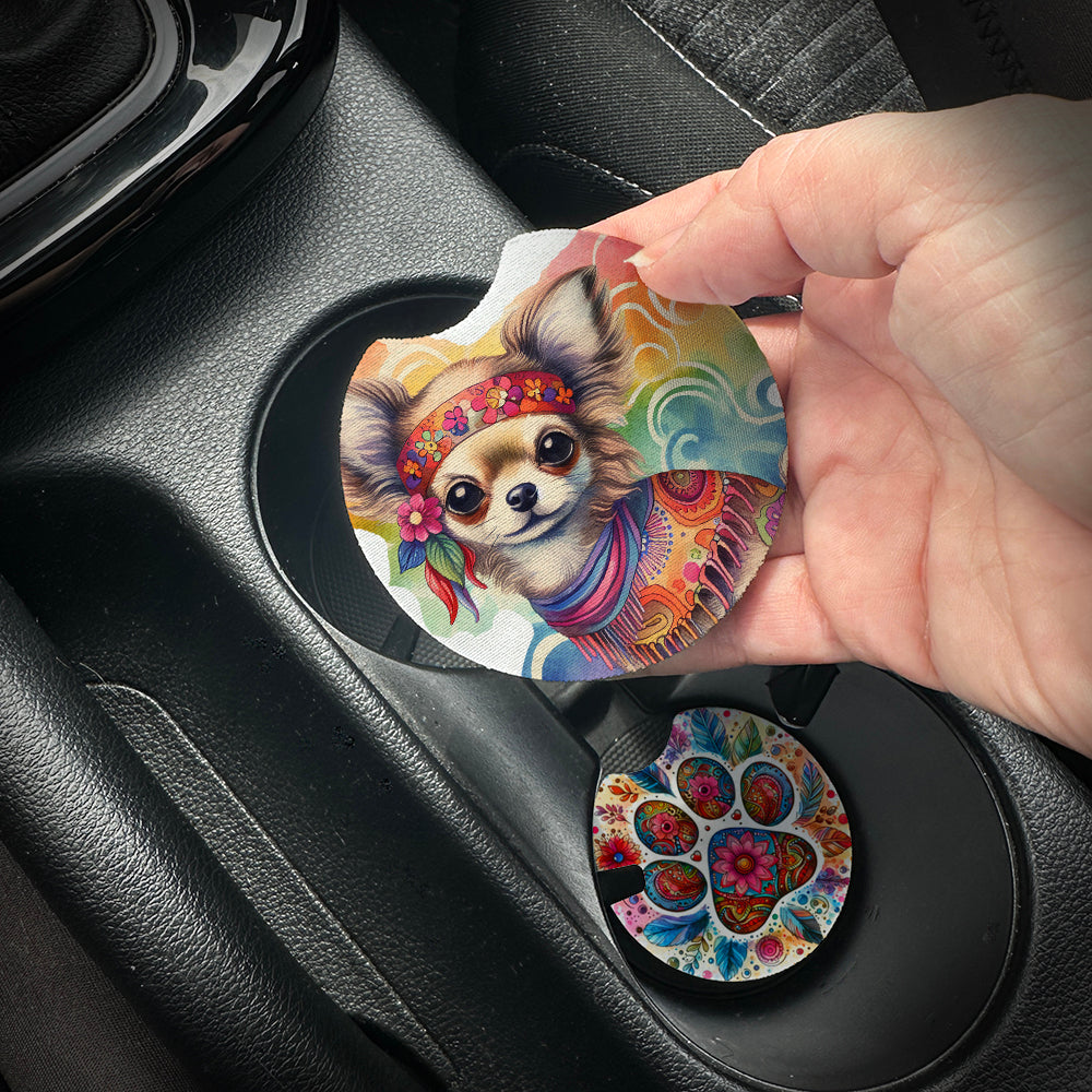 Hand placing a colorful car coaster with a dog design into a car cup holder.