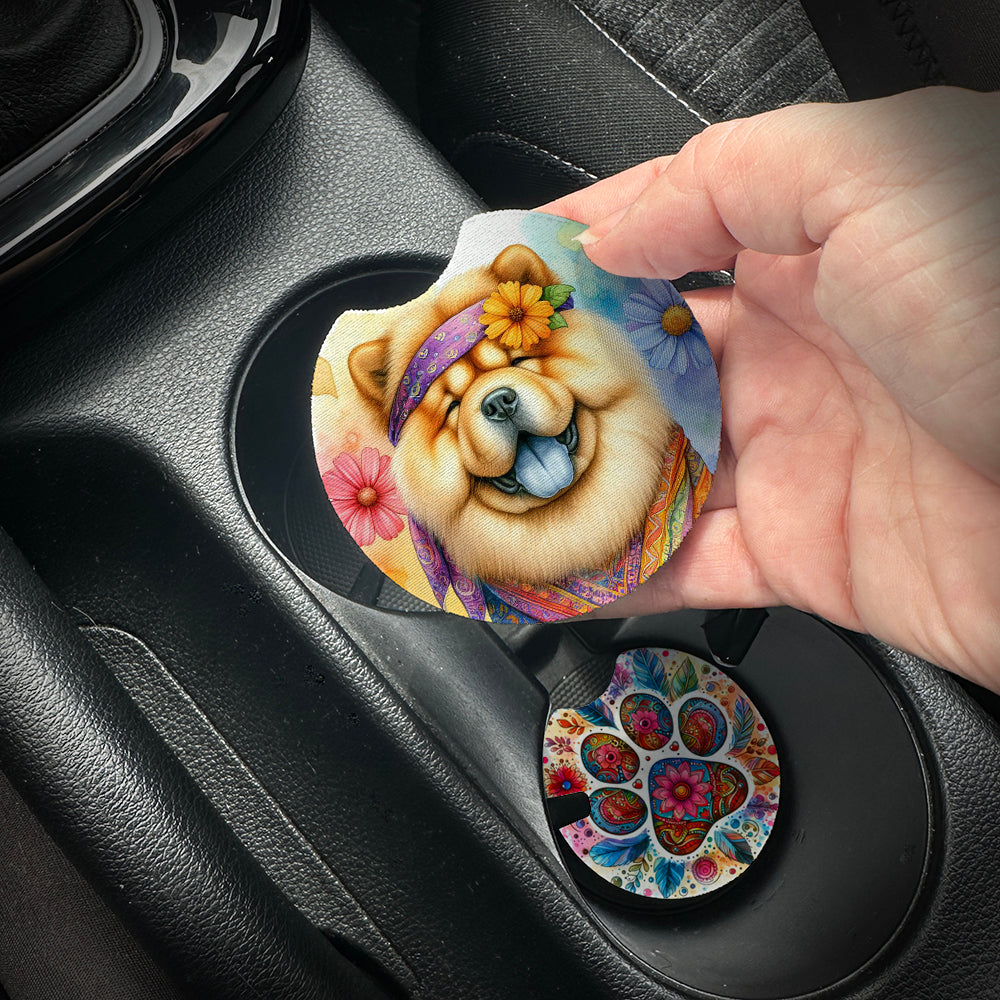 Hand placing a colorful car coaster with a dog design into a car cup holder.