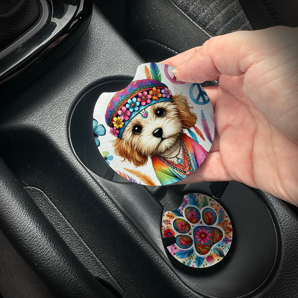 Hand placing a colorful car coaster with a dog design into a car cup holder.