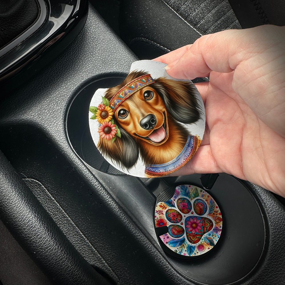 Hand placing a colorful car coaster with a dog design into a car cup holder.