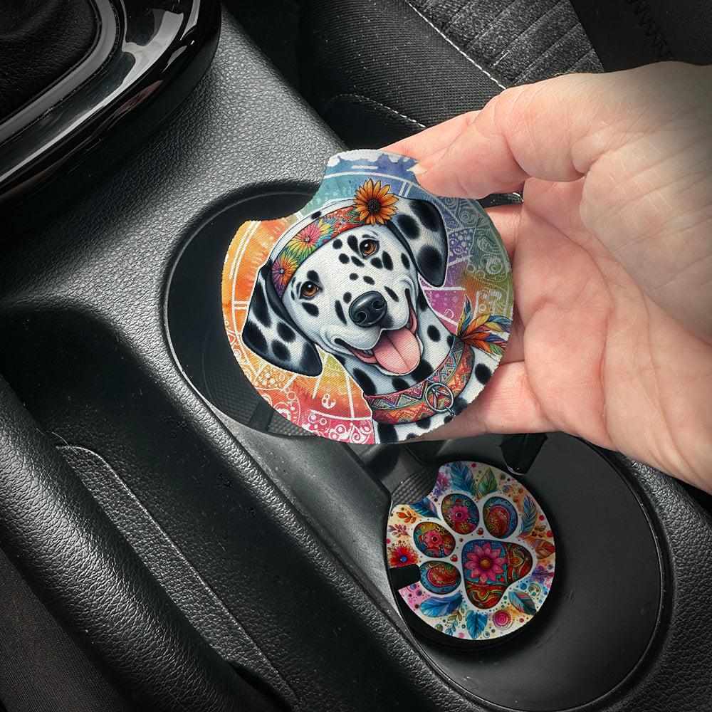 Hand placing a colorful car coaster with a dog design into a car cup holder.