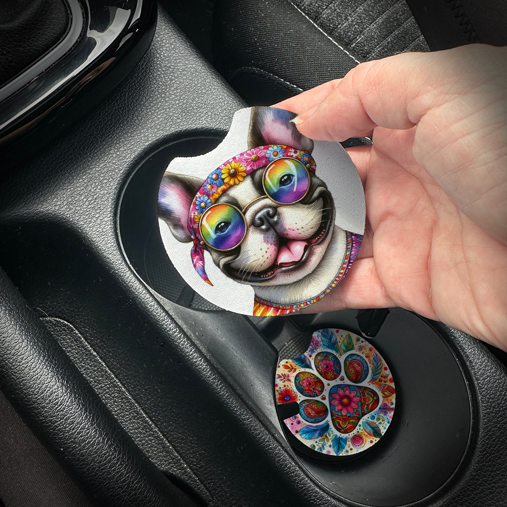 Hand placing a colorful car coaster with a dog design into a car cup holder.