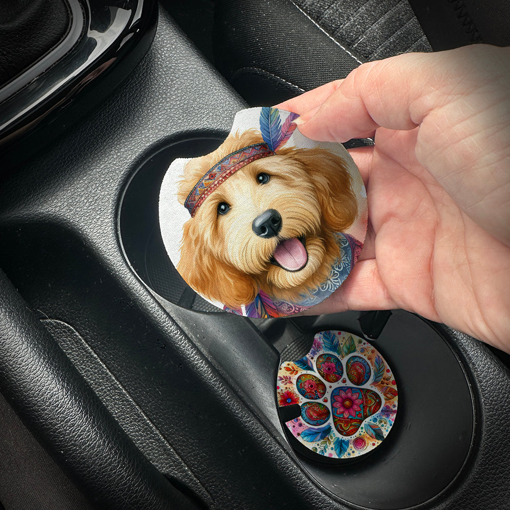 Hand placing a colorful car coaster with a dog design into a car cup holder.