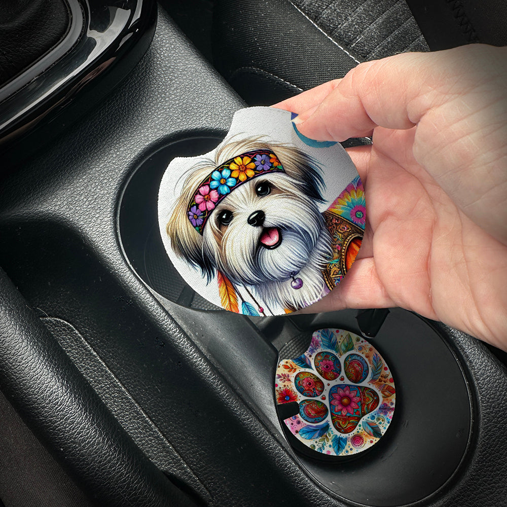 Hand placing a colorful car coaster with a dog design into a car cup holder.