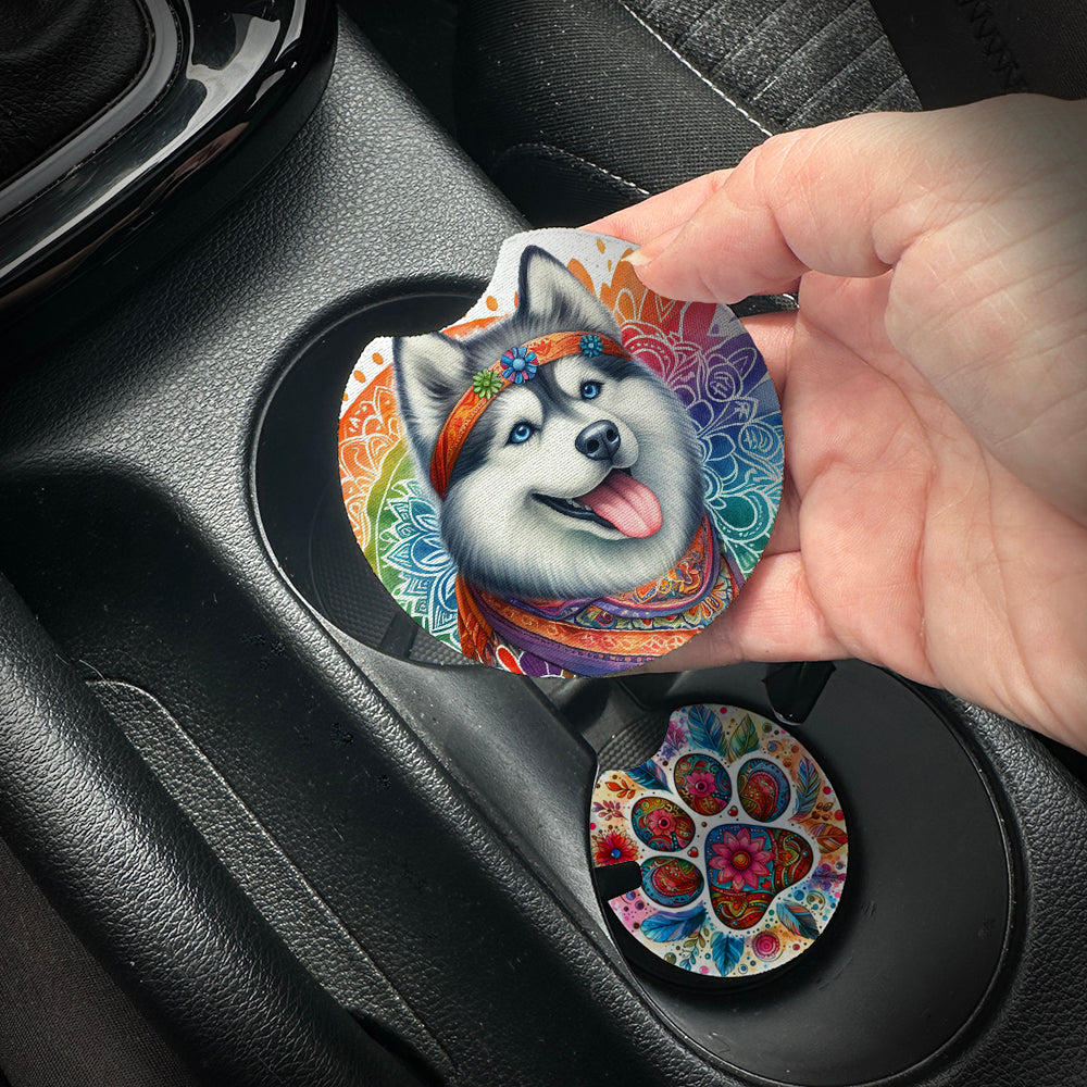 Hand placing a colorful car coaster with a dog design into a car cup holder.