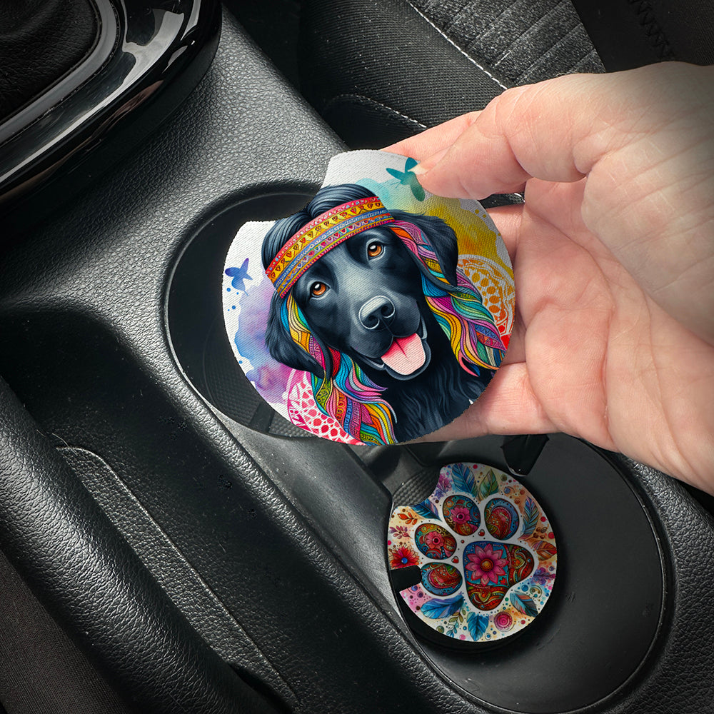 Hand placing a colorful car coaster with a dog design into a car cup holder.