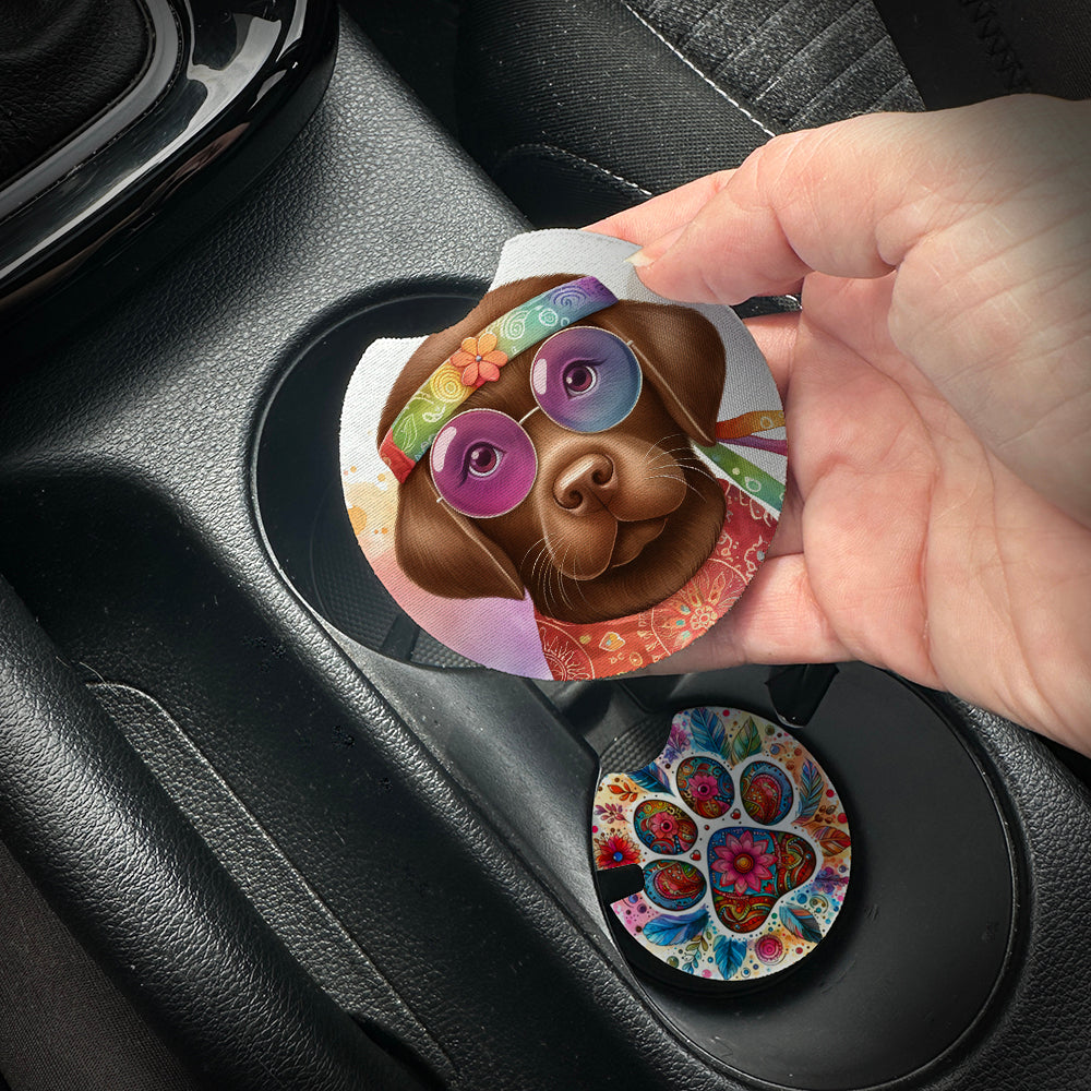 Hand placing a colorful car coaster with a dog design into a car cup holder.