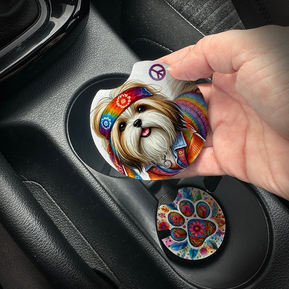 Hand placing a colorful car coaster with a dog design into a car cup holder.