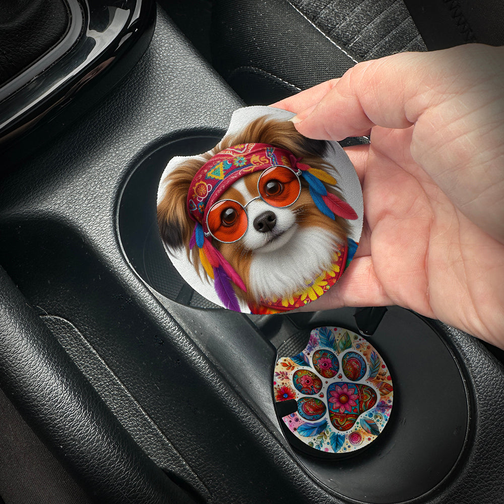 Hand placing a colorful car coaster with a dog design into a car cup holder.