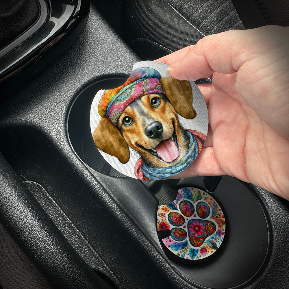 Hand placing a colorful car coaster with a dog design into a car cup holder.