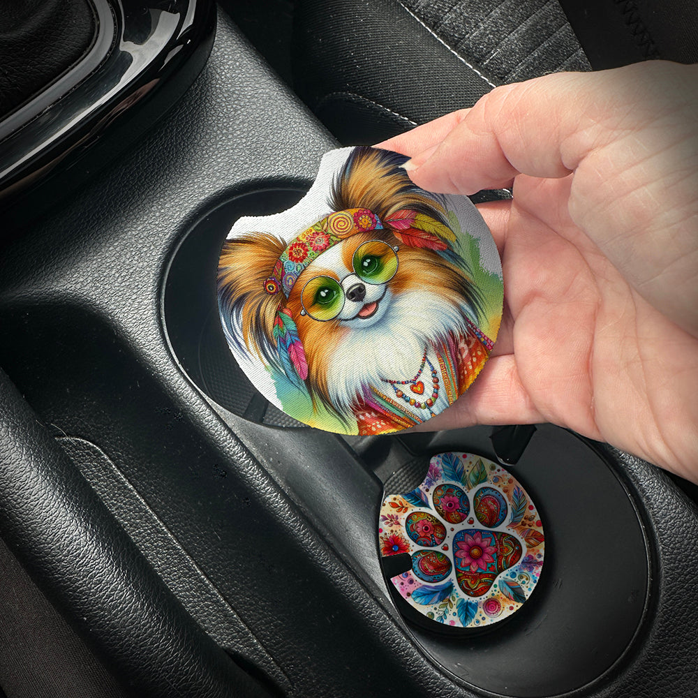 Hand placing a colorful car coaster with a dog design into a car cup holder.
