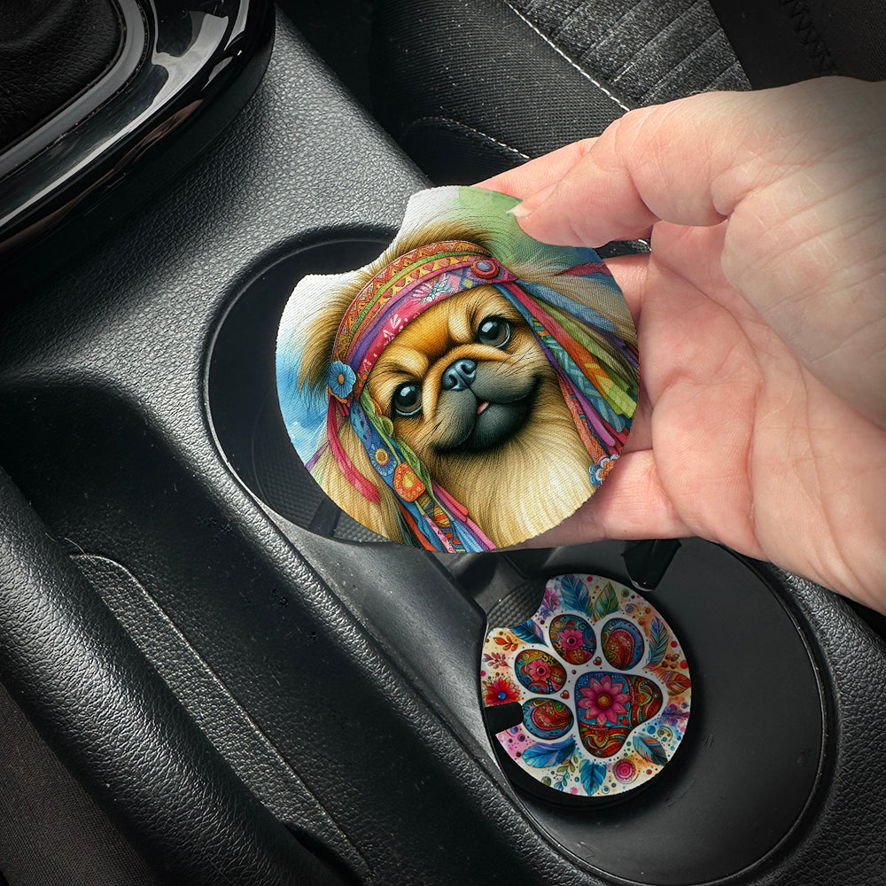 Hand placing a colorful car coaster with a dog design into a car cup holder.