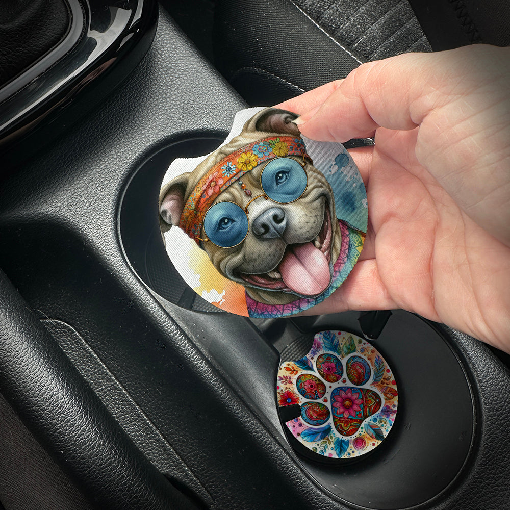 Hand placing a colorful car coaster with a dog design into a car cup holder.