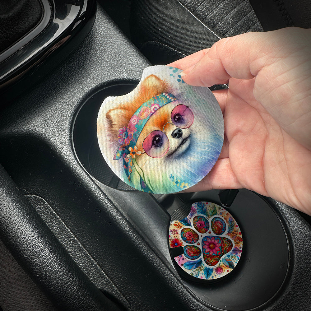 Hand placing a colorful car coaster with a dog design into a car cup holder.