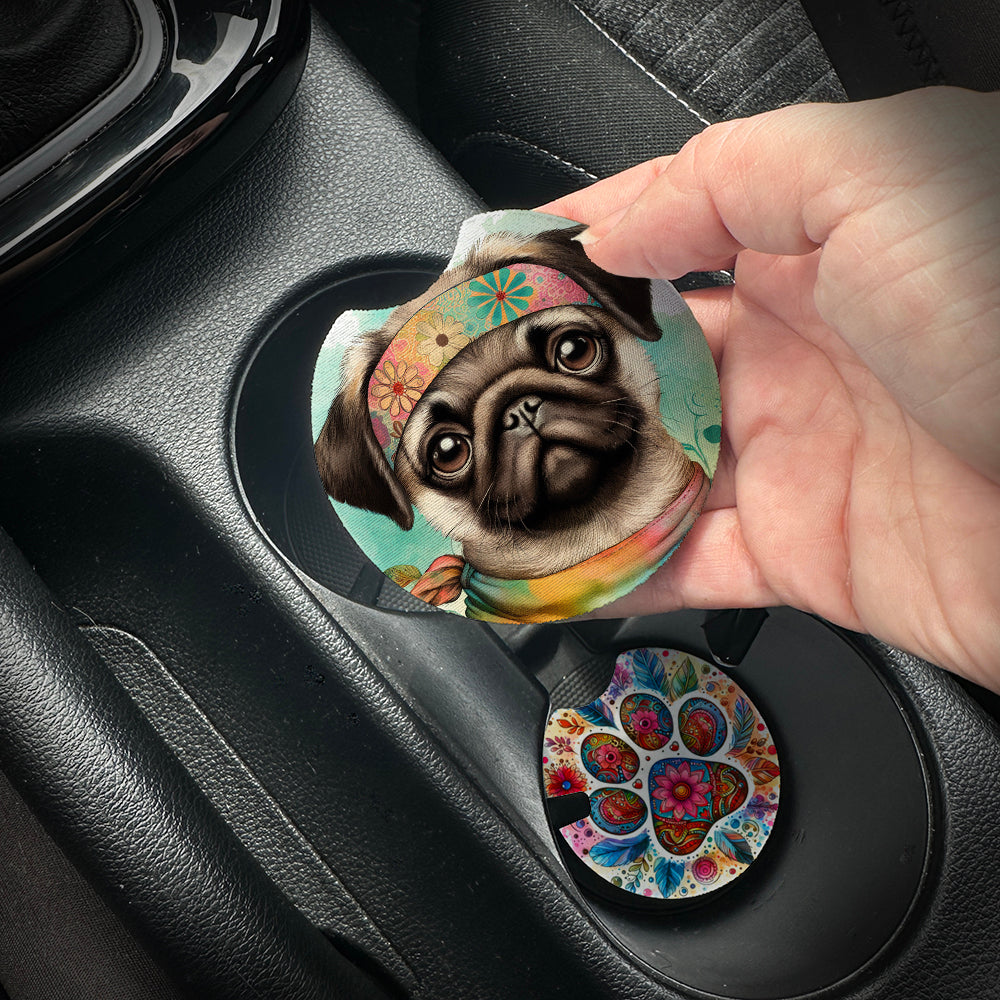 Hand placing a colorful car coaster with a dog design into a car cup holder.