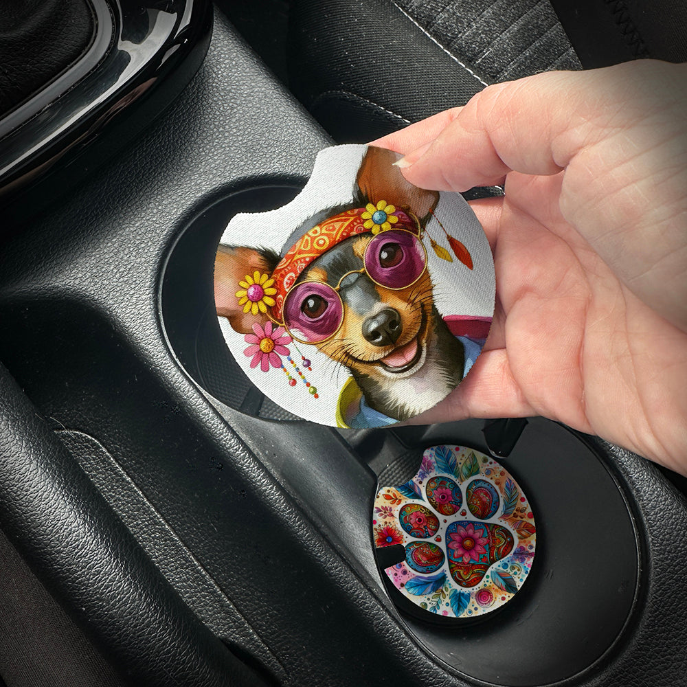 Hand placing a colorful car coaster with a dog design into a car cup holder.