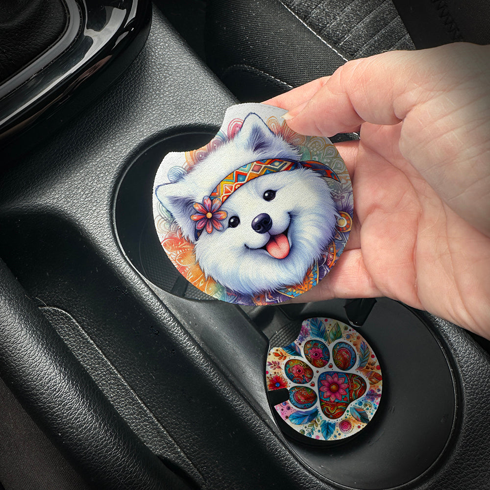 Hand placing a colorful car coaster with a dog design into a car cup holder.