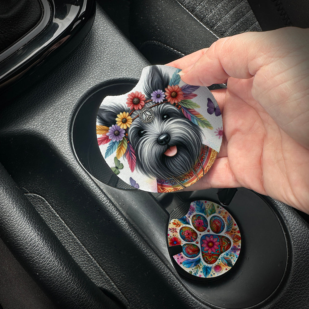 Hand placing a colorful car coaster with a dog design into a car cup holder.