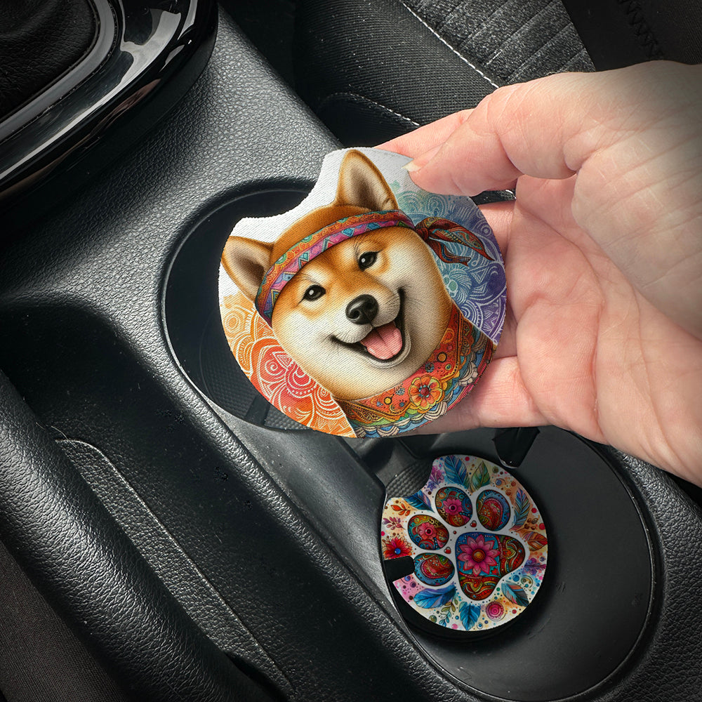 Hand placing a colorful car coaster with a dog design into a car cup holder.