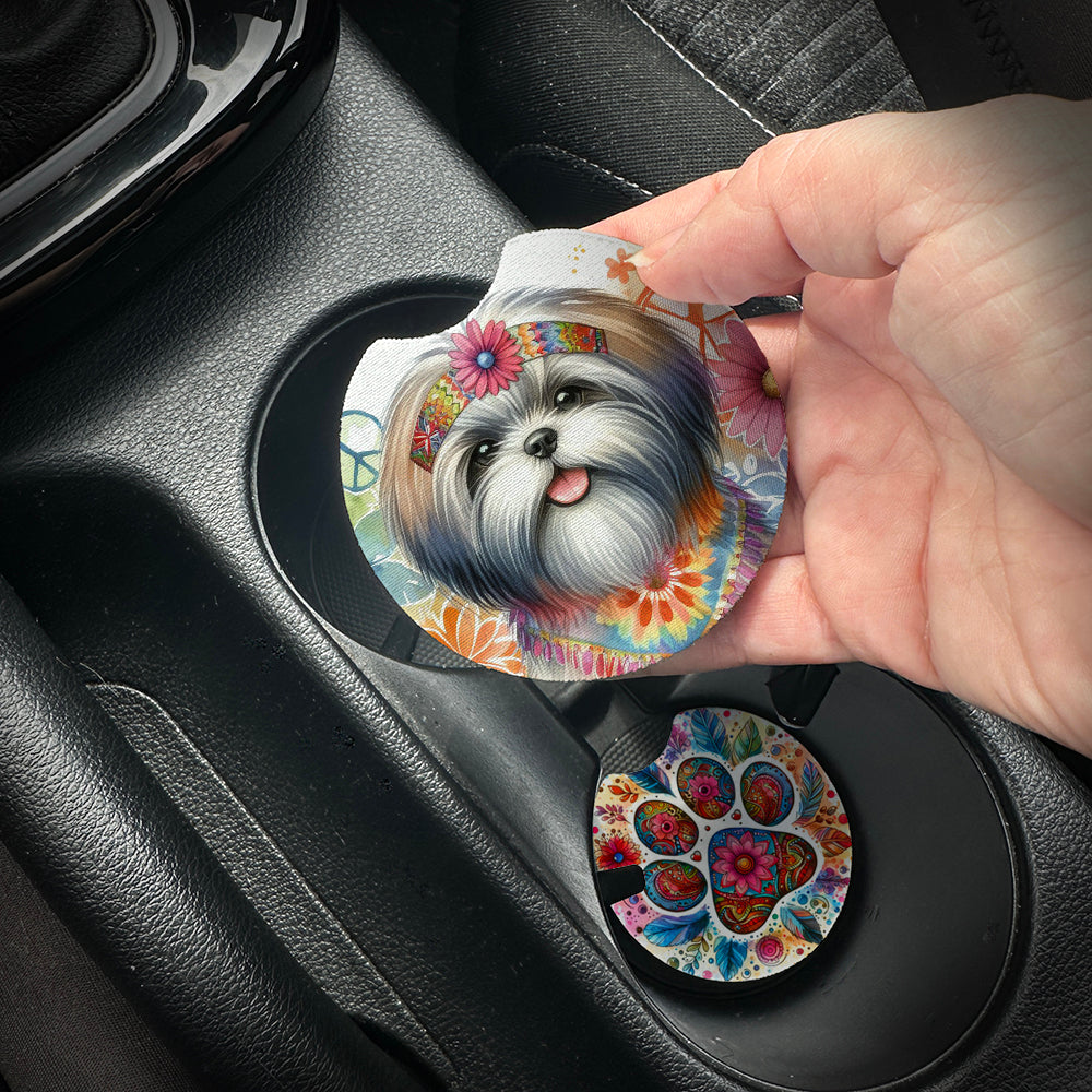 Hand placing a colorful car coaster with a dog design into a car cup holder.