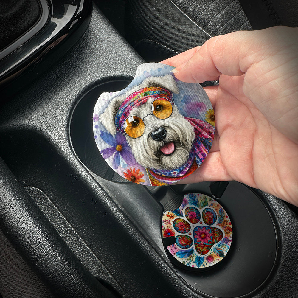 Hand placing a colorful car coaster with a dog design into a car cup holder.
