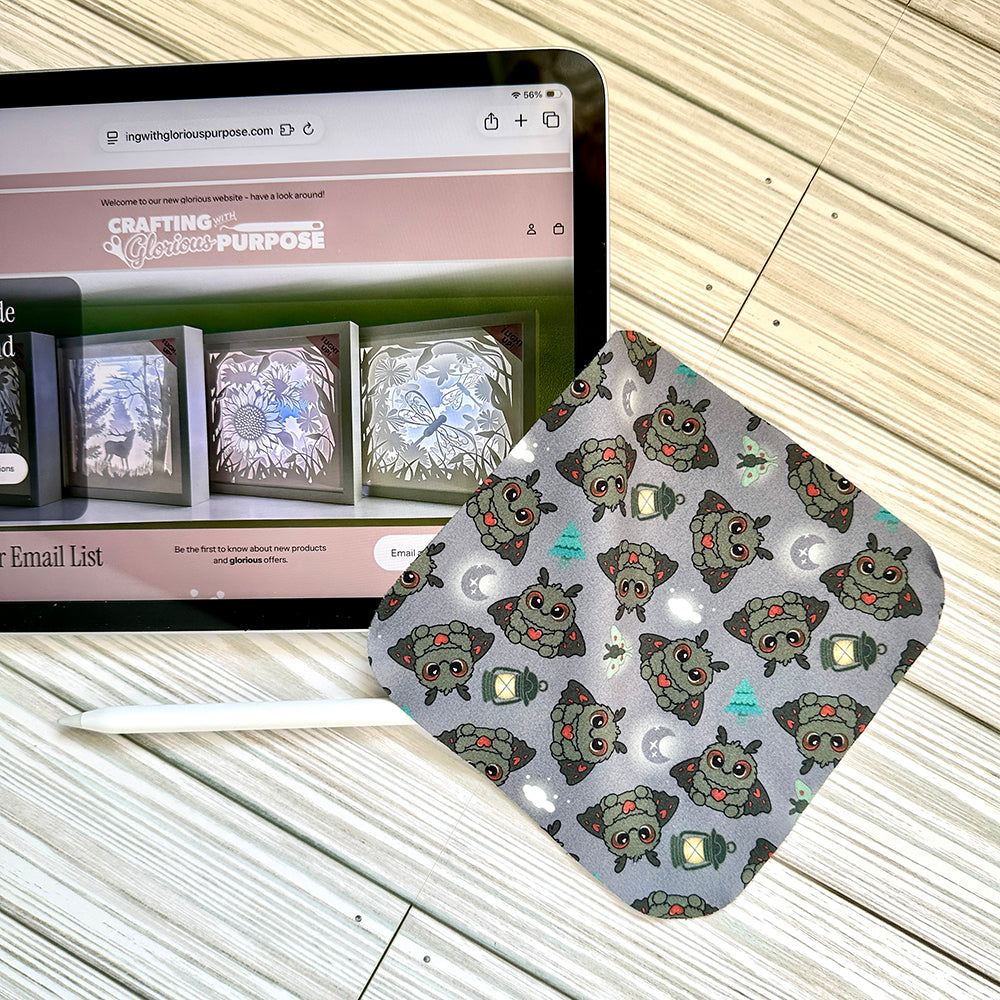 Tablet showing a Mothman screen cleaning cloth